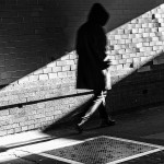 Hooded Figure in Shadow