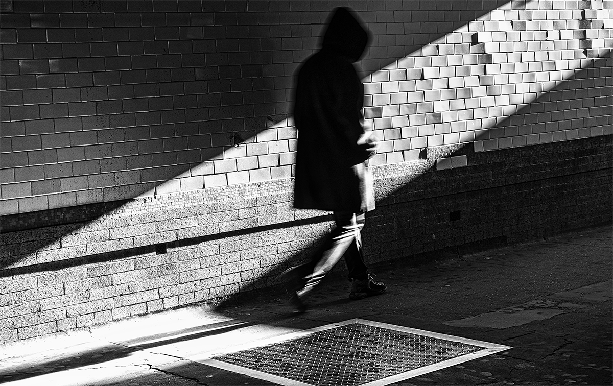Hooded Figure in Shadow
