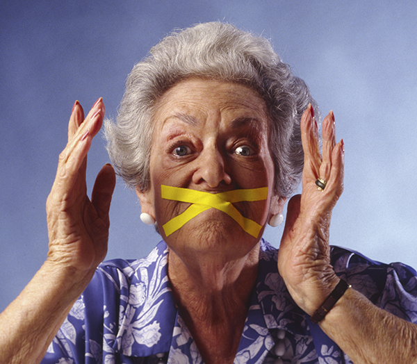 elderly woman with mouth taped shut